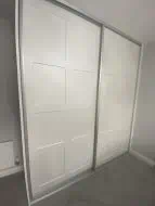 2 door sliding wardrobe with twin caraway panels in white with brushed silver frames, fitted in Thirsk (differnt angle)